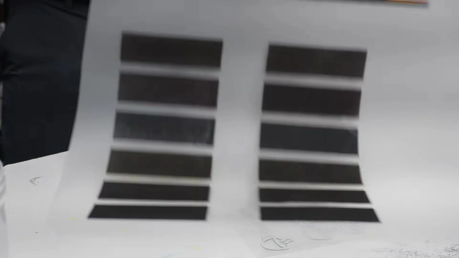 Closeup of black DTF powder on a transfer before pressing