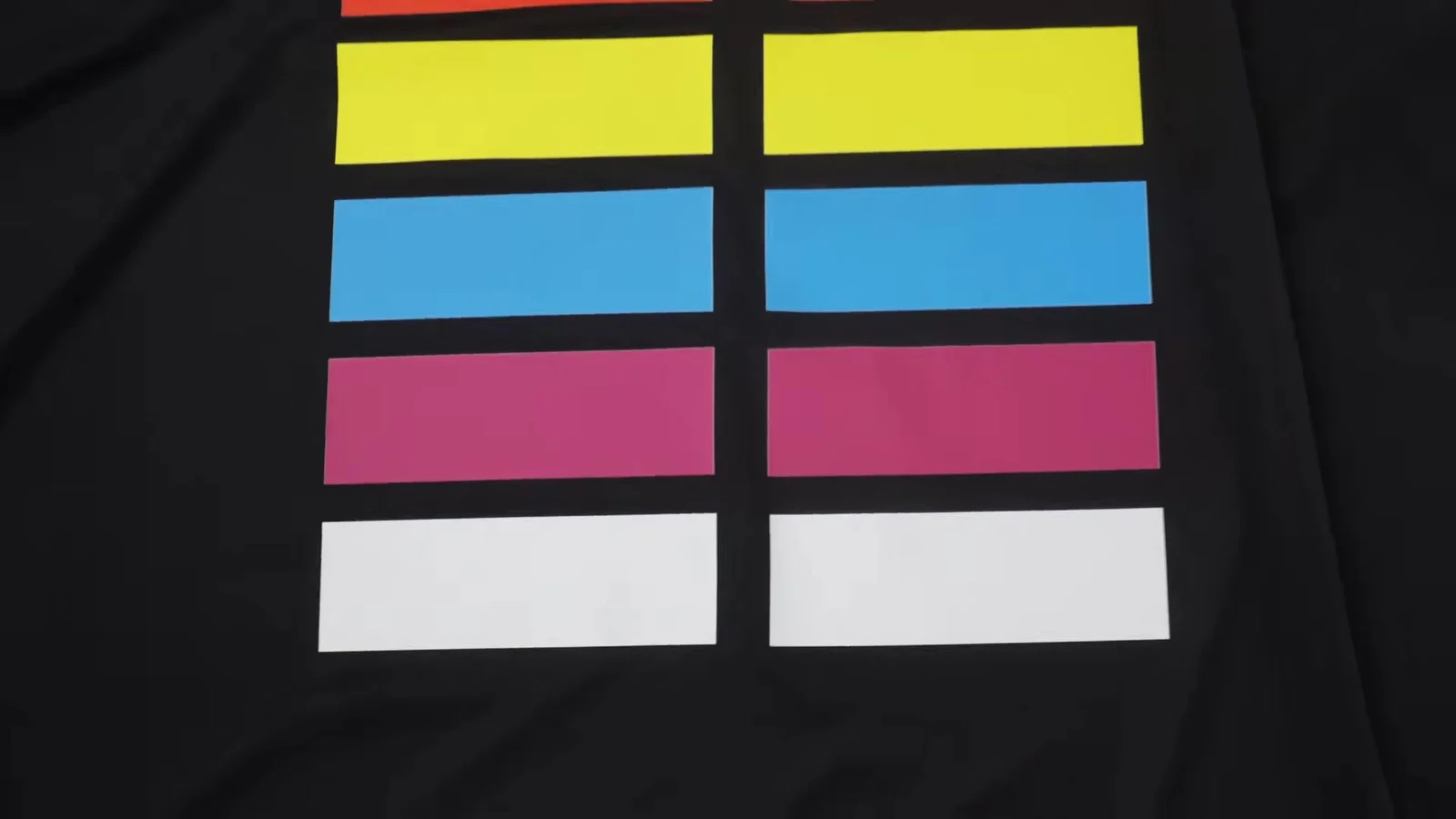 DTF color vibrancy comparison between white powder and black powder on black polyester